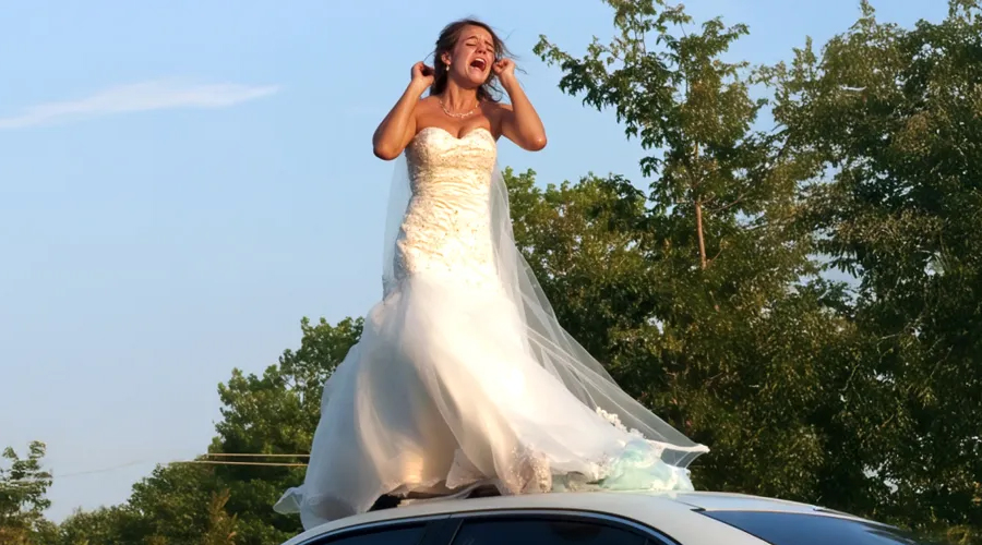 I Stepped Outside One Morning And Saw A Woman In A Wedding Dress On My Husband’s Car Roof