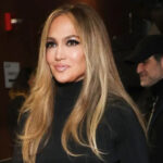 Jennifer Lopez made a surprise entrance at the Grammys and captured all the attention in a sheer skirt.