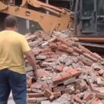 Feuding Neighbors Build Wall on Property Line