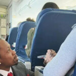 Delta Airlines flight attendant Floyd Dean-Shannon, 44, is going viral for his heartwarming customer service and exceptional in-flight hospitality. A trending photo of him sitting in the aisle, holding a