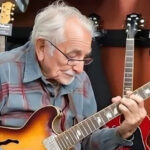 An 81-year-old grandpa walks into a guitar store, picks up one of the guitars, and starts playing to everyone’s amazement.