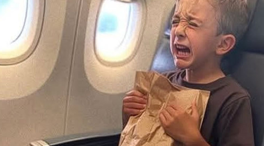 In the airplane restroom, I discovered a weeping young boy holding a paper bag, and he wasn’t listed among the passengers.